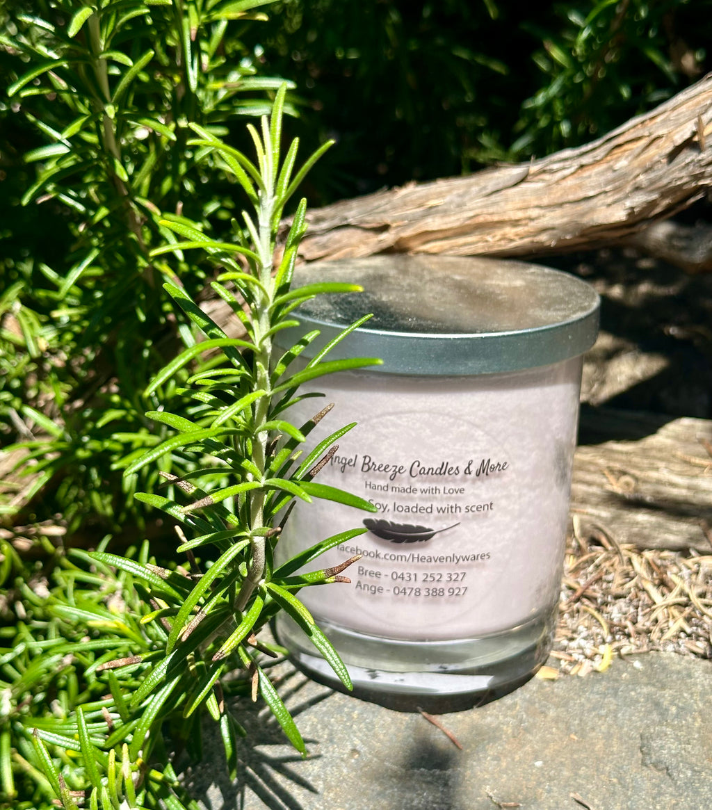 Sensual Musk tripled scented vegan soy candle nestled in rosemary bush
